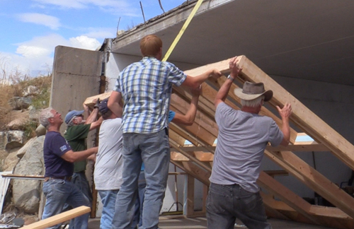 Buddys-wall-raising-still-reduced-and-cropped